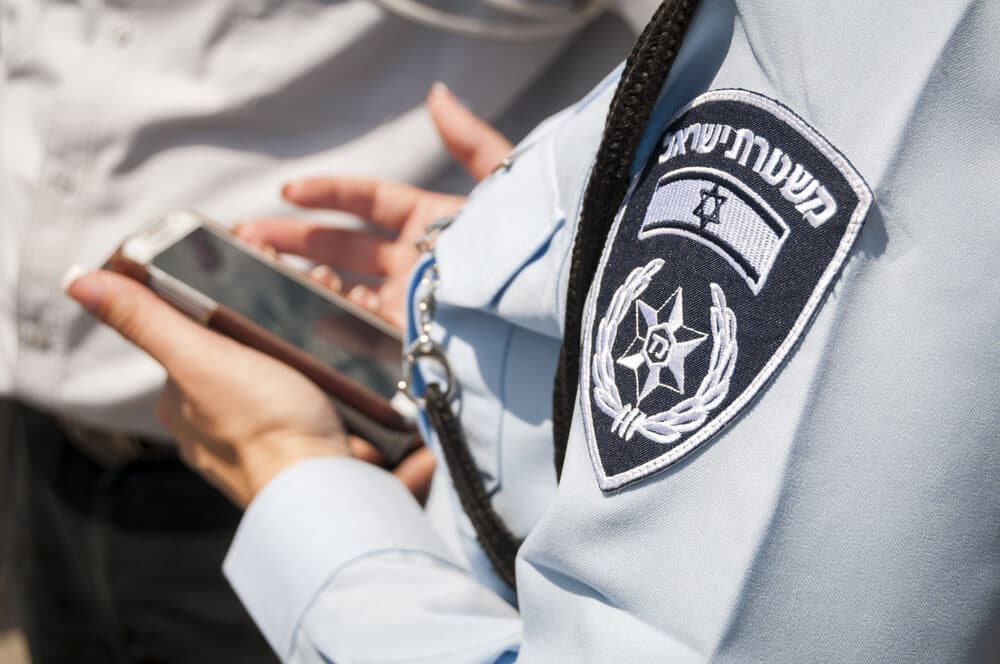 Israeli,Female,Police,Officer,With,An,Emblem,On,Her,Uniform חקירה במשטרה